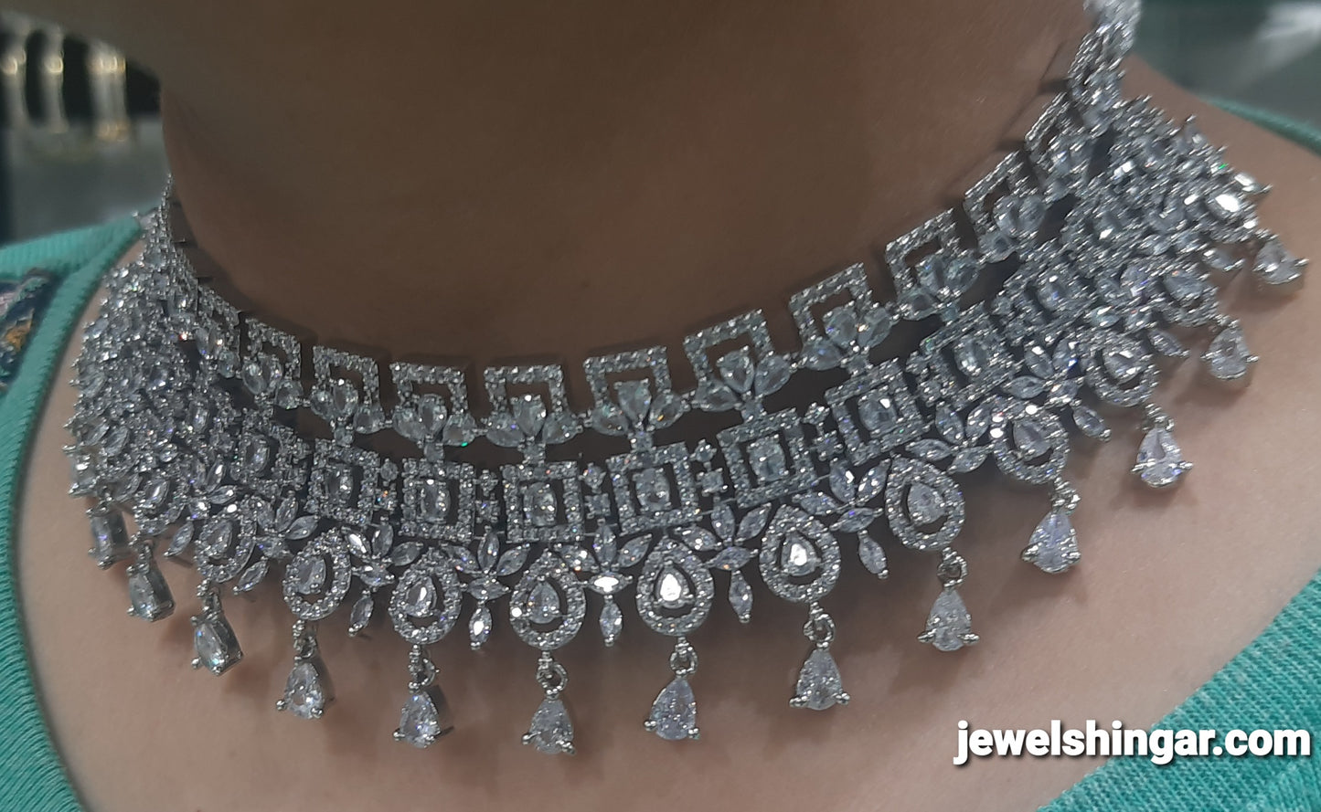 JEWELSHINGAR FINE ZIRCON SILVER PLATED DIAMOND LOOKING NECKLACE SET IN CHOKER STYLE WITH EARRINGS AND MAANGTIKKA FOR GIRLS
(234009JS)