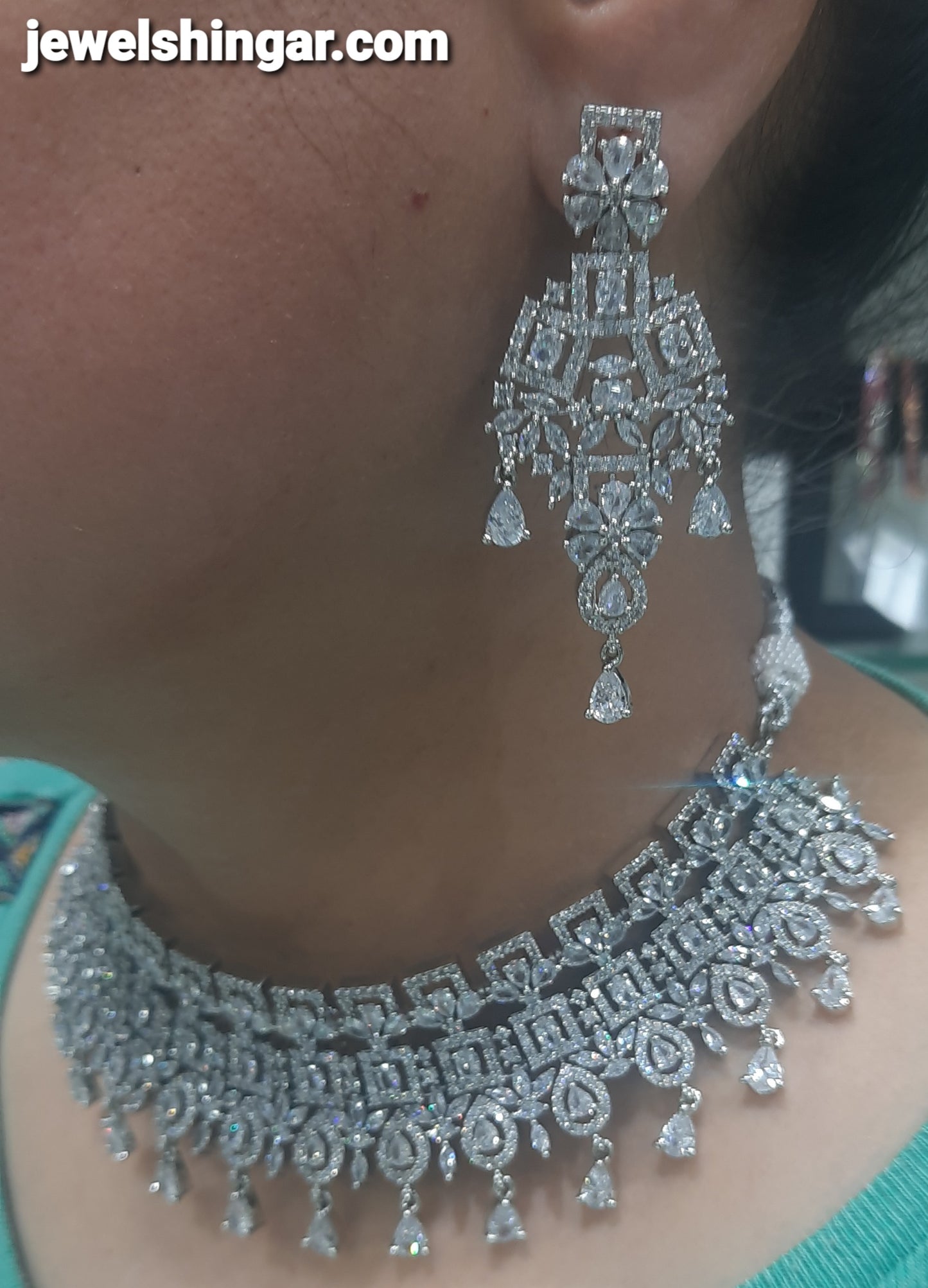 JEWELSHINGAR FINE ZIRCON SILVER PLATED DIAMOND LOOKING NECKLACE SET IN CHOKER STYLE WITH EARRINGS AND MAANGTIKKA FOR GIRLS
(234009JS)