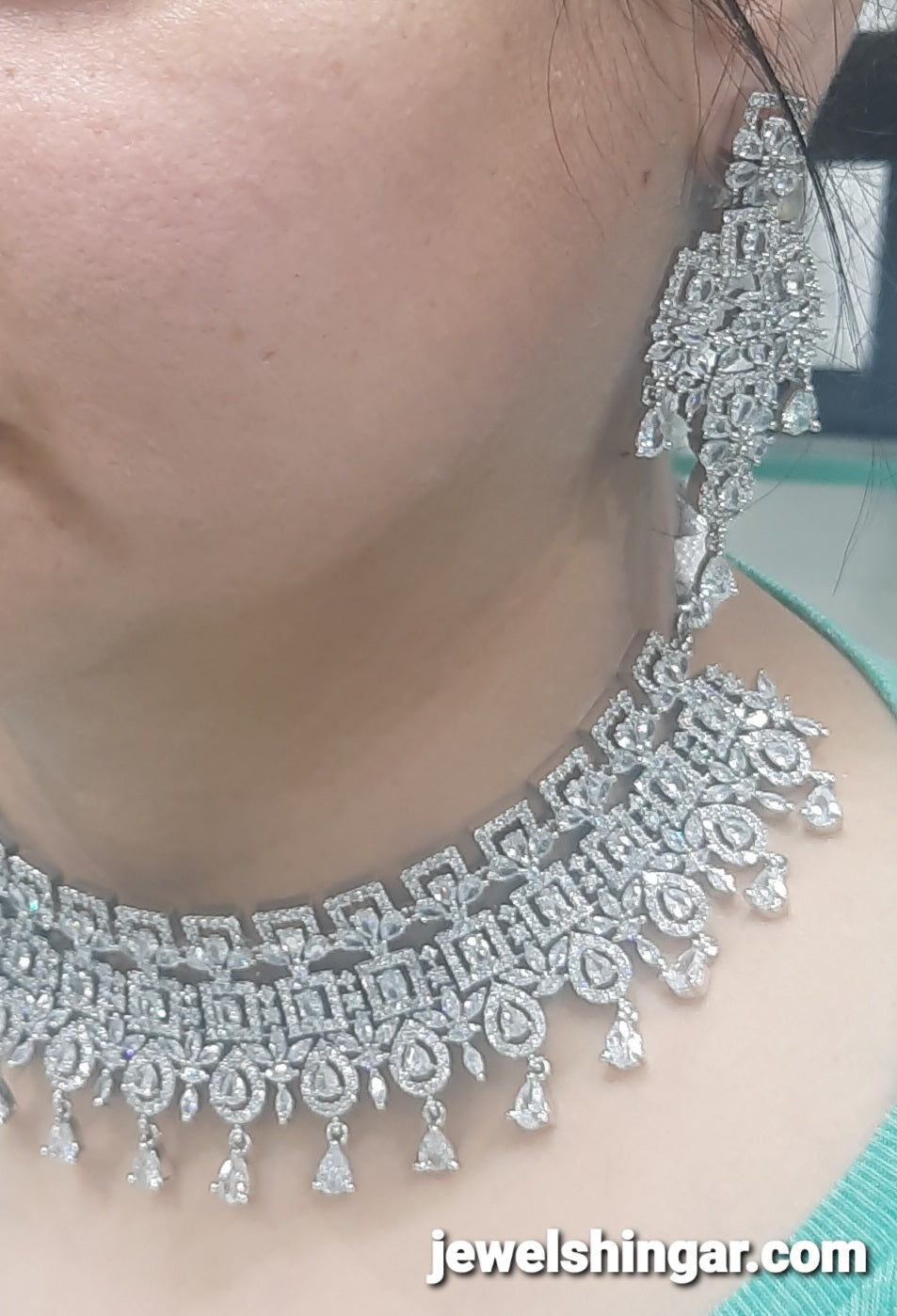 JEWELSHINGAR FINE ZIRCON SILVER PLATED DIAMOND LOOKING NECKLACE SET IN CHOKER STYLE WITH EARRINGS AND MAANGTIKKA FOR GIRLS
(234009JS)
