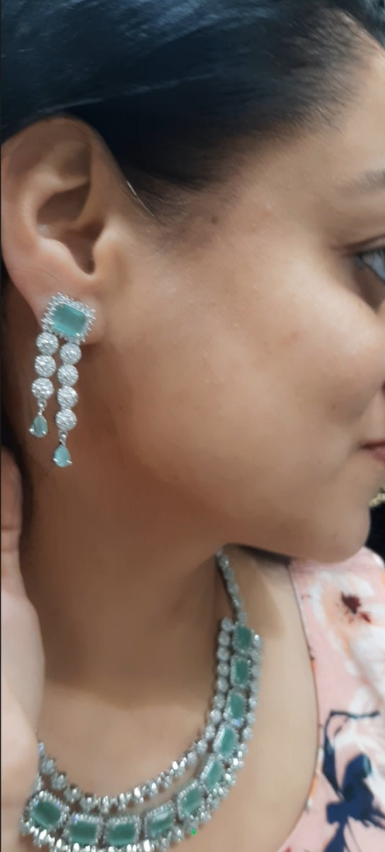 Jewelshingar light green color necklace set in diamond look (93743NAD)