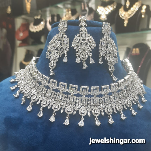 JEWELSHINGAR FINE ZIRCON SILVER PLATED DIAMOND LOOKING NECKLACE SET IN CHOKER STYLE WITH EARRINGS AND MAANGTIKKA FOR GIRLS
(234009JS)