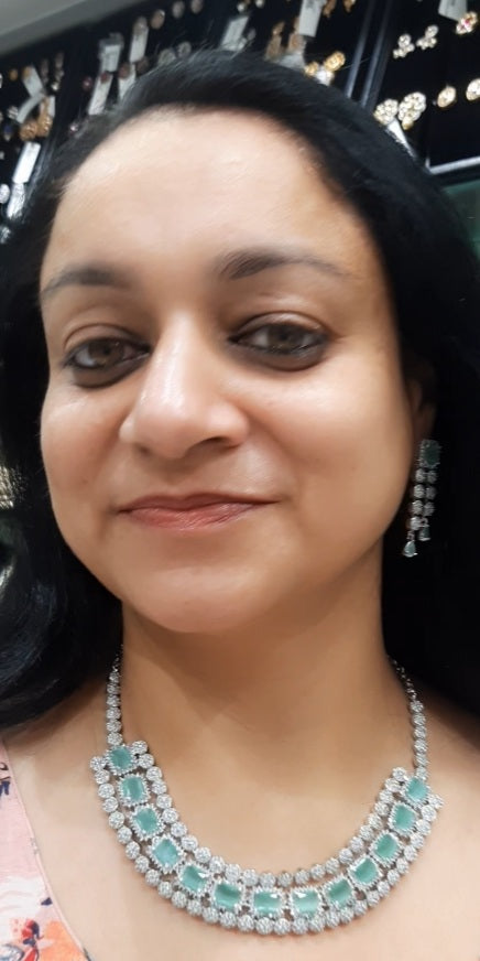 Jewelshingar light green color necklace set in diamond look (93743NAD)
